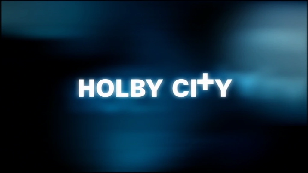 Holby City text logo displayed on a dark blue gradient background